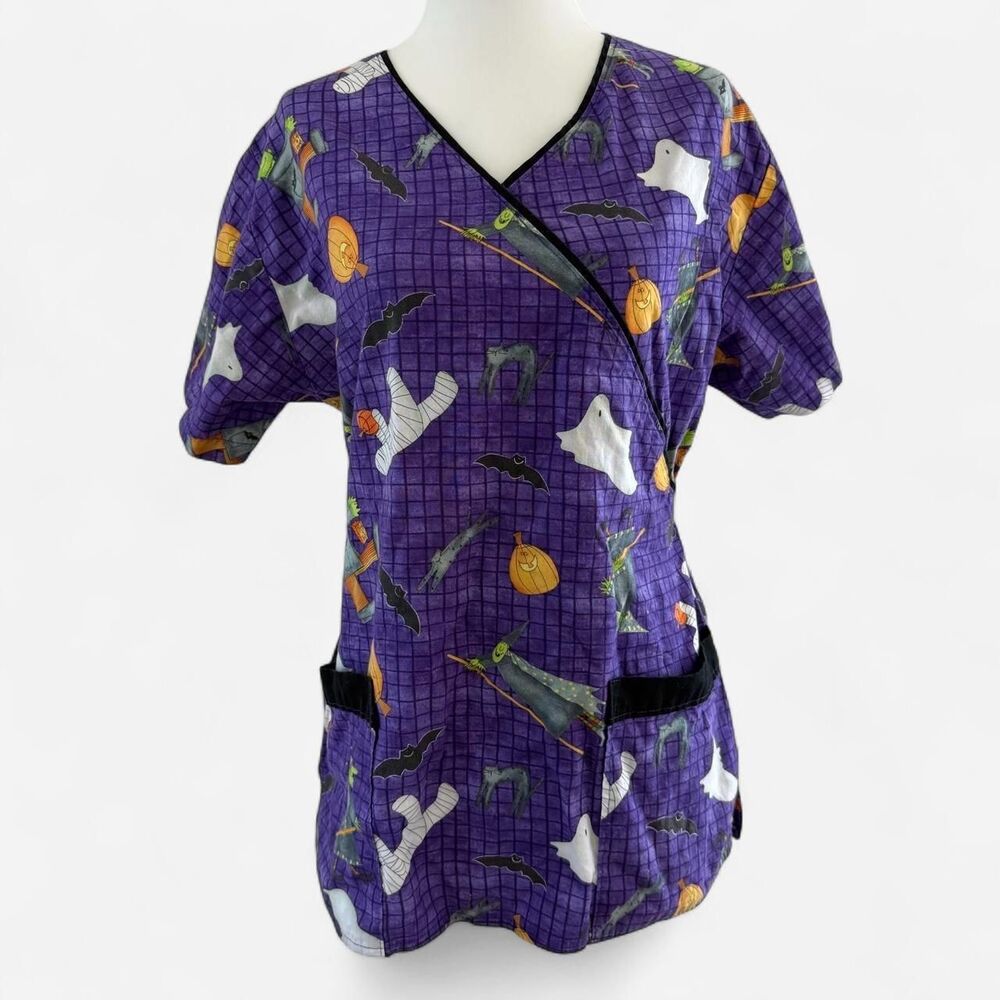Purple Halloween scrub top themed graphics including ghosts, mummies, witches